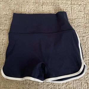 NWOT. Athleta Blue and White Athletic Shorts with Curved Hem